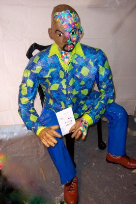 Life-size and attached to home-made papier mache chair