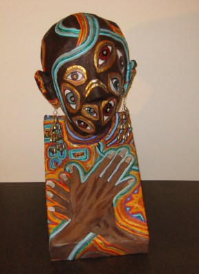 African Queen of Paranoia, without the large gold cascading earrings that I made for her but which catch the light too much to photographed.